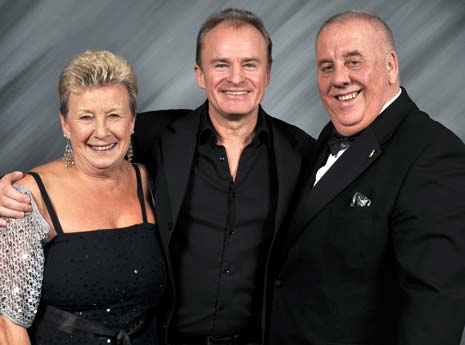 Bobby Davro pictured with Kids 'n' Cancer Charity Founders Mike and June Hyman
