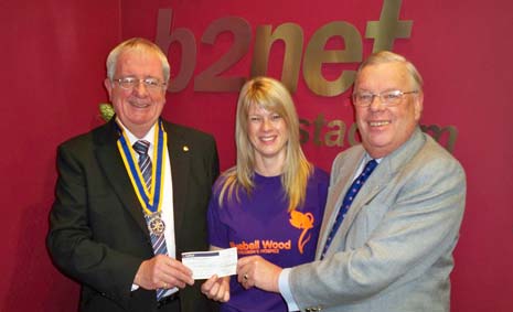 Andrea Hudson, fundraiser for the Bluebell Wood Children's Hospice receives the cheque for £400 from a collection at the B2Net