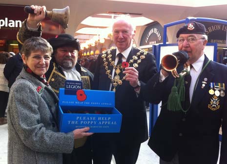 Margaret Topley, Town Crier, Henry Crier, The Mayor and Bugler Ken Treswell buy the first poppies of Chetsrefield's campaign