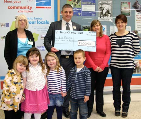 Tesco store manager, Michael Cooke, presents a £600 cheque to the Bo Peeps mother and toddler group enabling them to continue running a much needed 2nd weekly session in Old Whittington.