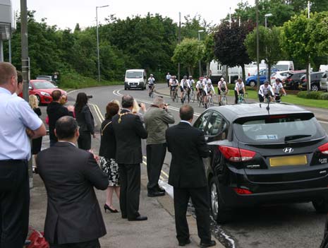 The riders are cheered in as they arrive at Autoworld in Chesterfield this morning