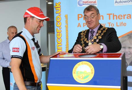 The Mayor of Chesterfield draws out the winners name with Autoworld's Simon Priestnall's help while Charity Founder Mike Hyman (left) waits to verify the winning ticket