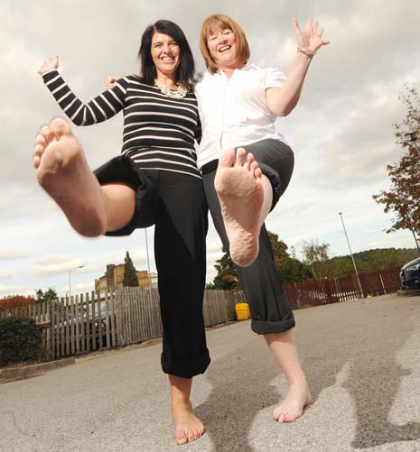 Ingrid Kennedy and Miranda Kravaris from youth and adult learning organisation TBG Learning Chesterfield have put their foot in it by volunteering to walk barefoot over red-hot embers to raise money for Sight Support Derbyshire.