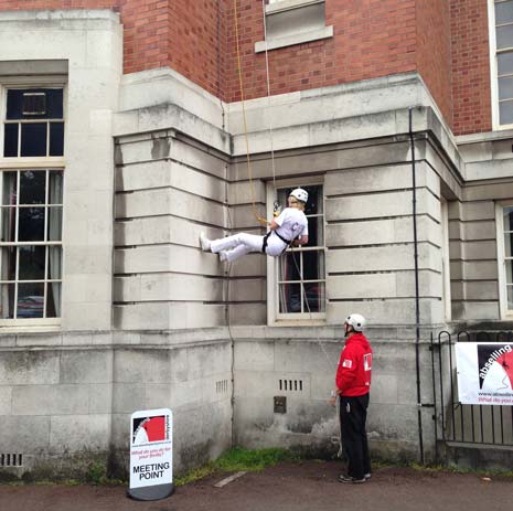 The Mayor's Secretary Vivian Miller finishes her spiderman impression