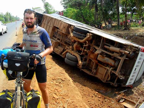 Dave Cook in front of the wreckage of the crashed coach