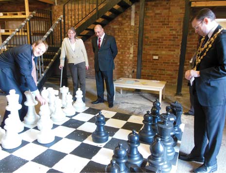 Chesterfield MP Toby Perkins takes on Chesterfield Mayor Cllr Paul Stone in a game of giant chess, watched by Yvette Dislins and Cllr Barry Dyke