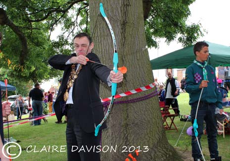 Mayor Stone tries out the Archery at the Old Whittington Gala