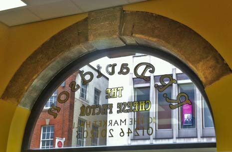 Under that was a headstone, we realised then this was one of the windows to the Market Hall originally and the headstone says 'Geo Thompson - builder'and it is engraved 'Davies and Tew Architects'.