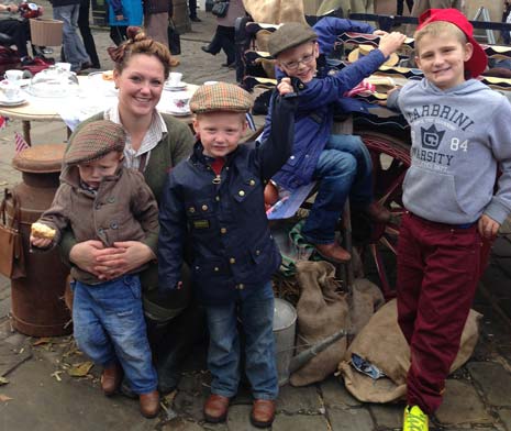 Last year's winner of the Best Stall Holder Lucy - the 'Land Girl' - with her Children
