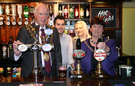 The Mayoress pulls the Gardener's first pint!