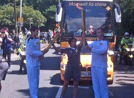 The crowds are lining the streets for the Olympic Relay as we get to the 7th Torch Bearer