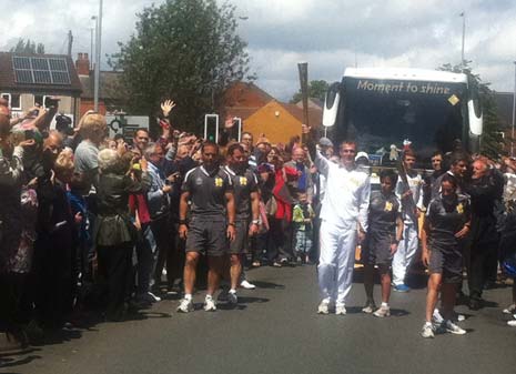 Policeman Shaun Morley - whom we interviewed - takes over his leg in the olympic Torch Relay