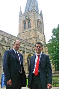 Toby Perkins and David Miliband pose in front of the Spire.