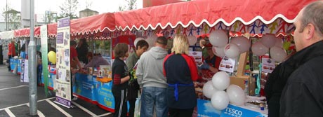 Stalls and visitors at the Tesco Community Fair