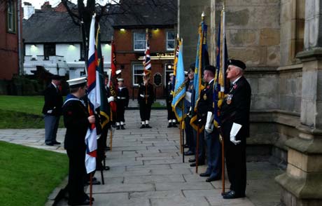 Veterans wait to receive dignitaries at the Crooked Spire