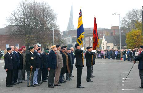 The Veterans form up and come to attention to mark the 2 minute silence