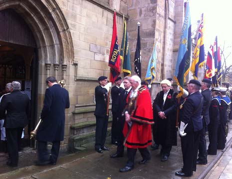 Dignitaries arrive under a guard of honour for the Service
