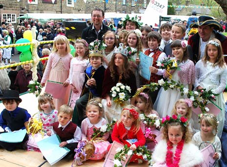 The May King and Queen and their Royal retinue pose for the photographer at the official opening ceremony.