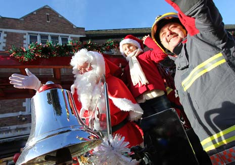 Santa Arrives At Chesterfield Co-Op In Red Hot Vintage Fire Engine