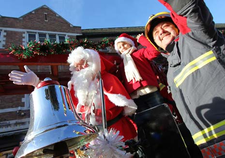 Santa Arrives At Chesterfield Co-Op In Red Hot Vintage Fire Engine