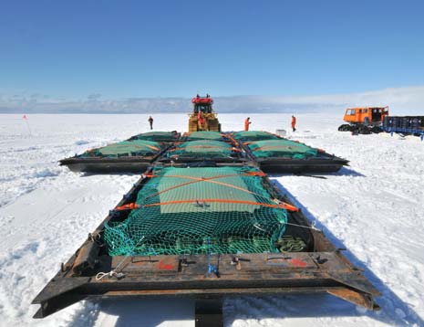 Images sent to Matlock from Antarctica this week show the skoots attached to two Finning caterpillar tractors which have been specially modified to tow them in a 'train' across the ice and snow wilderness