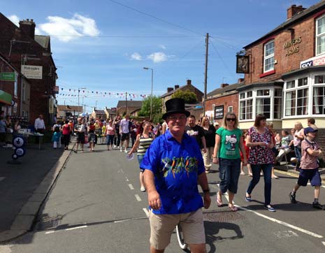 Pip (in the hat) joins the parade for New Whittington's First Village Gala