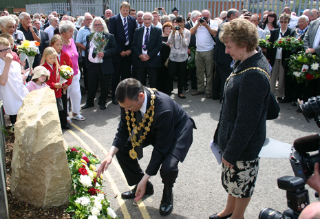 Chesterfield Mayor Paul Stone and Mayoress Barbara Wallace lay their wreath at the memorial with dignitaries and familes looking on