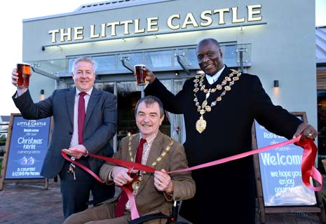 FESTIVE CHEERS -  Derbyshire County Council Chairman Councillor Steve Freeborn, centre, officially opens The Little Castle with Mayor of Chesterfield Councillor Alexis Diouf, right, and manager Rob Freeman.