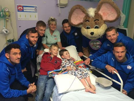 The Spireite players also took along some Christmas cheer as they greeted the youngsters at their bedsides and handed out goodie bags packed full of gifts