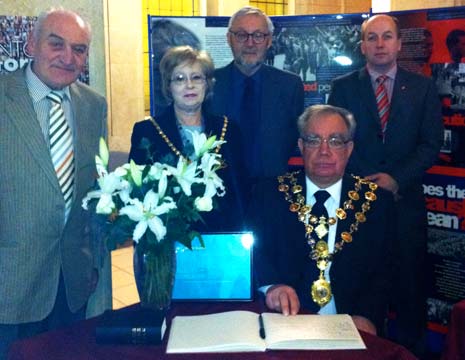 The Mayor and Mayoress sign the Holocaust Commemerative Book in the Town Hall