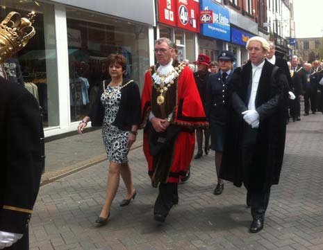 The Parade heads to the Town Hall to take the salute