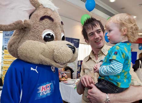 Eden Thompson (2) and his dad Simon Ball meet Chester the Chesterfield FC mascot at the Rykneld Homes Family Fun Day held at the Proact Stadium