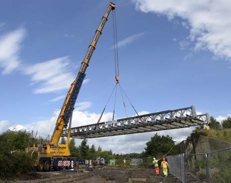 One of the country's largest cranes was in Derbyshire on Tuesday to remove a bridge deck as part of plans to expand Derbyshire County Council's flagship Markham Vale regeneration site.