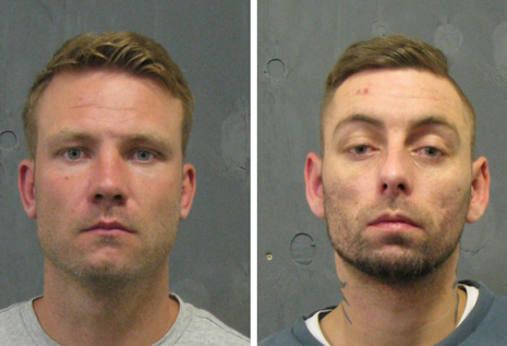 Two robbers who pinned their victim to the ground after attacking him on his doorstep have been jailed for a combined total of nine years.