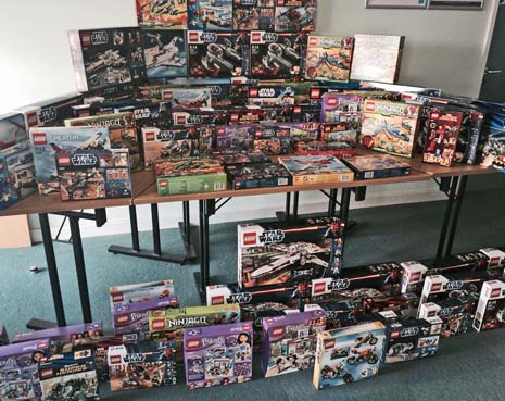 A haul of more than 200 boxes of Lego which were seized by police from a convicted shoplifter are being donated to children's charities.