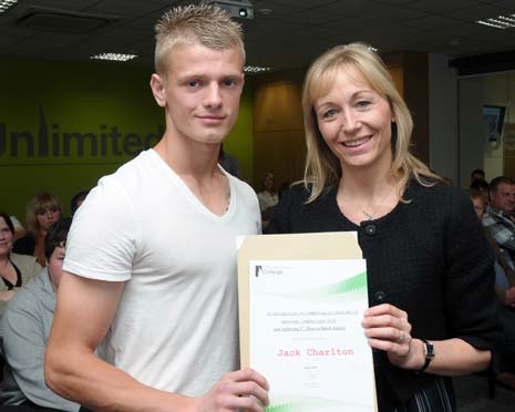 Jack Charlton is presented with his joinery award by Chesterfield College deputy principal, Julie Richards