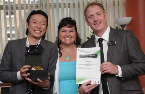 Takumi Miyamori receives his award from Hairdressing Programme Manager, Ian Elsom and Curriculum Manager for Hair and Beauty, Sheila Unwin