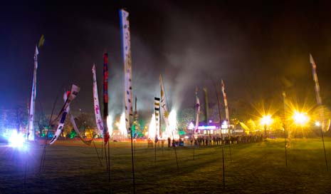 hundreds of student-designed flags provided the perfect backdrop to a grand performance of fire juggling and fireworks