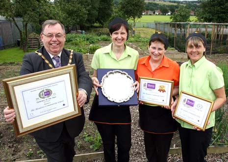 TOP NOSH: (from left) Councillor George Wharmby, Chairman of Derbyshire County Council, presents the 2012 Caterers of the Year award to catering supervisor Jeanette Kirk and catering team members Edith Smith and Michelle Ashby, in the school vegetable garden.