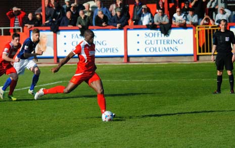 dusting himself down to take the penalty himself and score with a confident shot into the corner of the net.