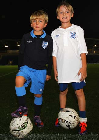 Mascot competition winner Josh Stevenson (right) and 