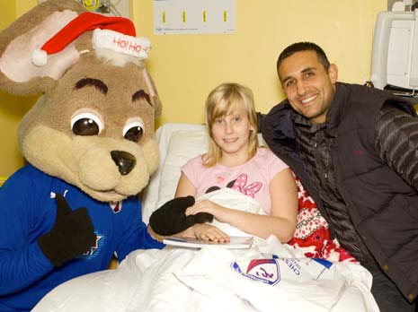 The visit, organised by the club's Community Trust, saw players taking time out from their training schedule to hand over official club merchandise and gifts donated by Tesco Distribution Centre to the excited youngsters, and pose for photographs and sign autographs.