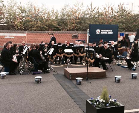 A crowd of supporters, and dignitaries including Chesterfield CEO Chris Turner, were at the rear of the Spencer Community Stand, to witness the formal ribbon cutting and to hear Ireland Colliery Chesterfield Brass Band playing a medley of tunes