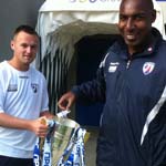 Andy Morris draws the England Mascot winner from the League 2 championship trophy