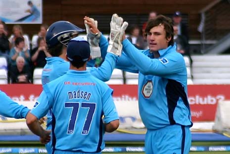 Tom Knight celebrates the first of his 3 wickets for 16 runs