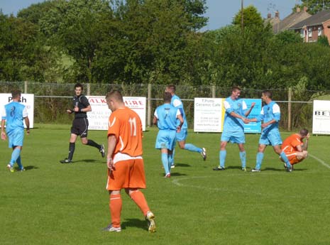 Clay Cross' players congratulate team-mate Rockie White on his hat-trick