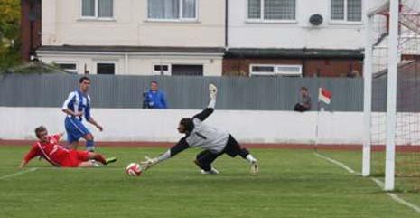 Gooles keeper parries an effort across goal