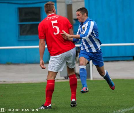 Jordan Turner (above) battled fruitlessly against Heanor's giant centre back Brett Peel all game