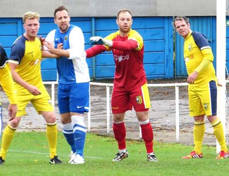 Staveley striker Ryan Damms makes his presence felt in the Tadcaster box